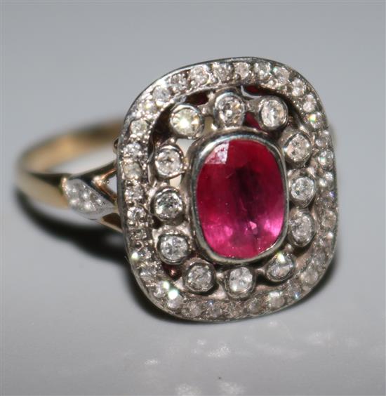 A Victorian style gold, ruby and diamond cluster ring, with diamond set shoulders, size O.